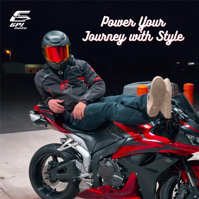 Motorcycle rider wearing GPI MOTO armored jacket and protective pants